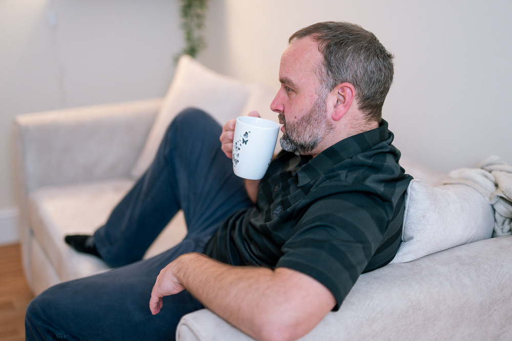 Homeless Supported Accommodation - Man drinking a hot drink