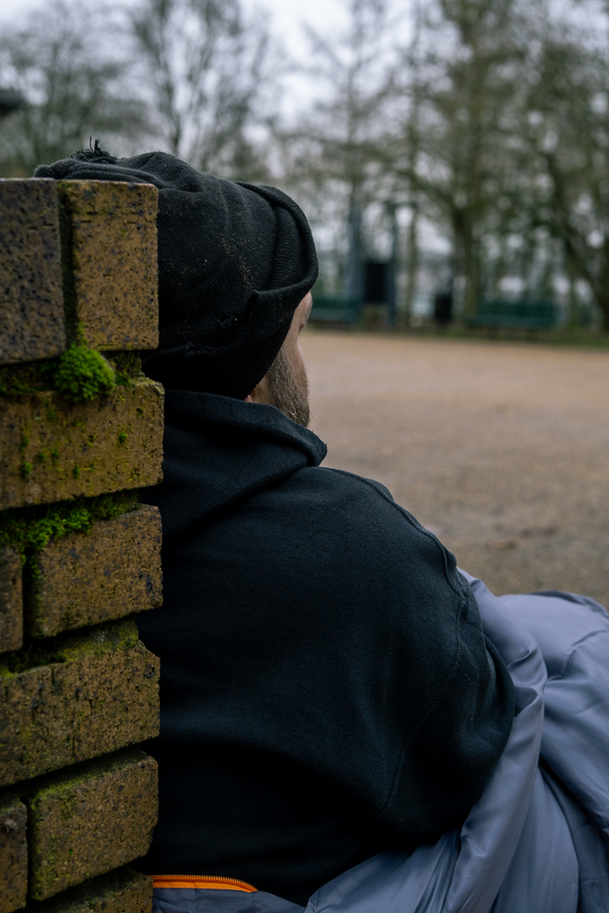 homeless man sat outside
